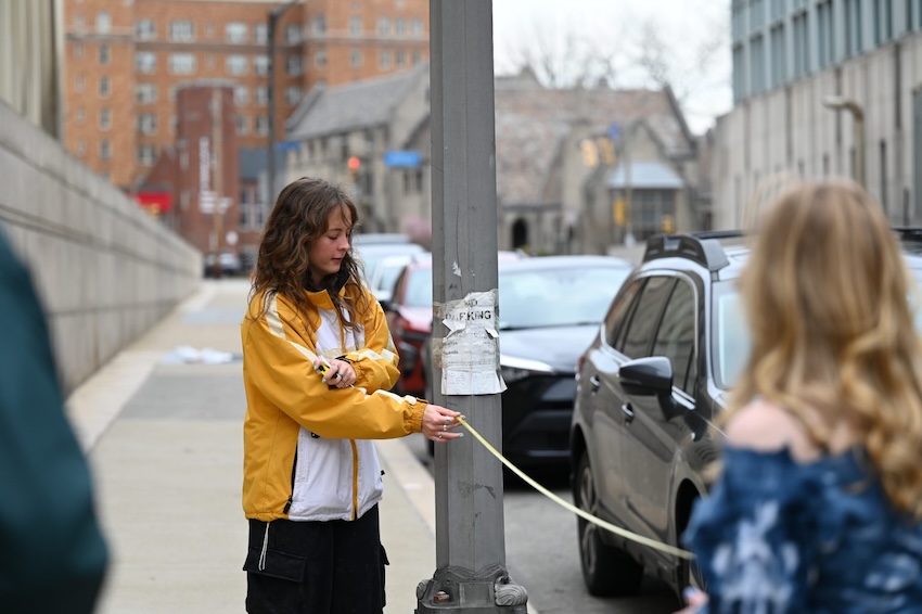 person measuring on the street
