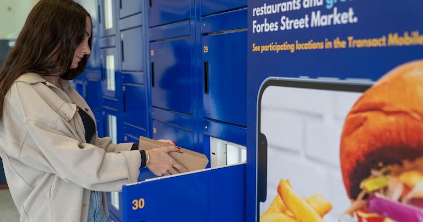 Student getting food from a food locker