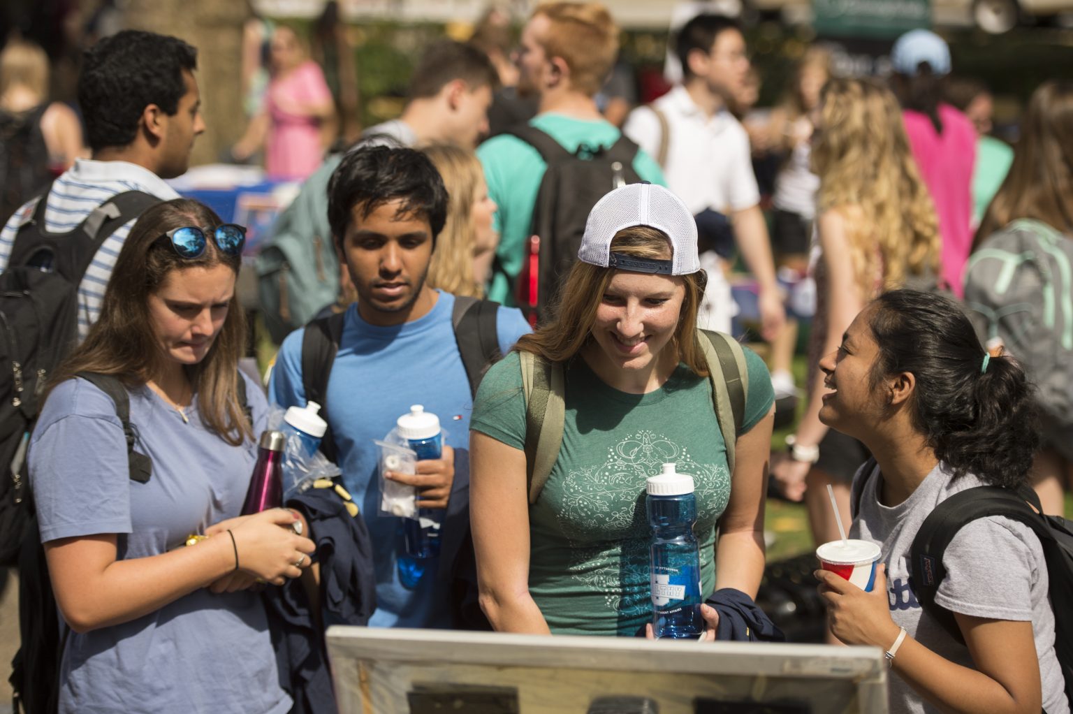 Students hold water bottles