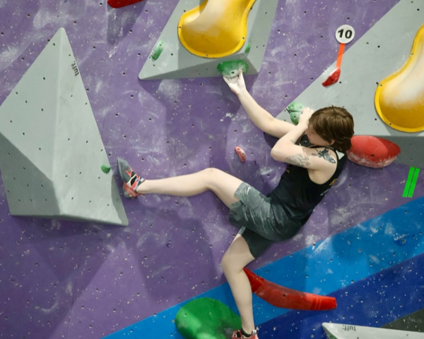 student on a climbing wall