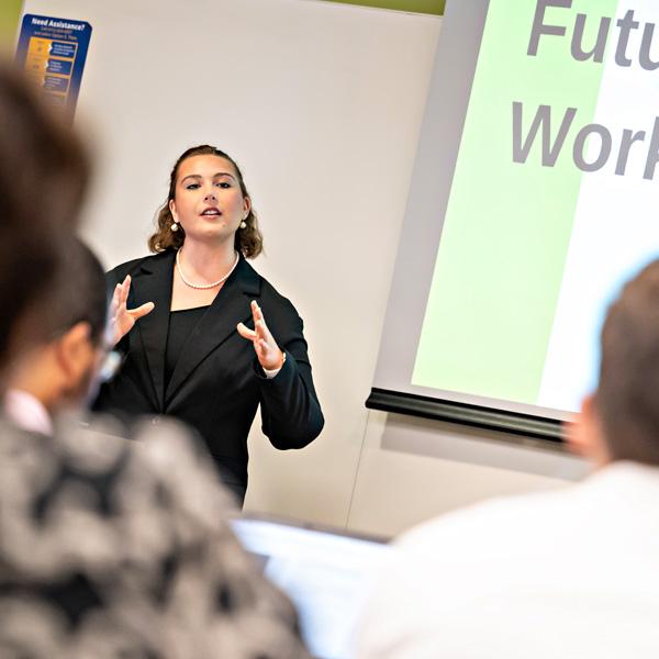 A woman delivers a presentation. 