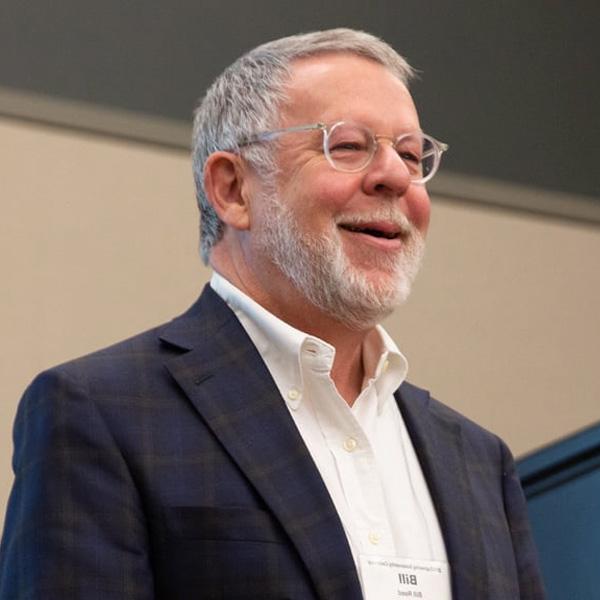 person speaking at a lecture