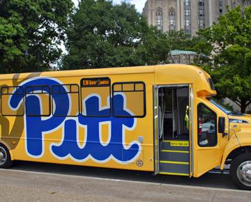 Yellow shuttle with Pitt in blue lettering