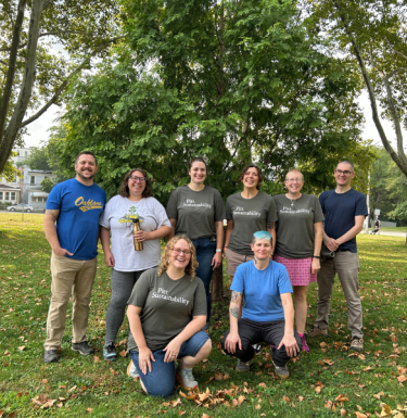 Tree Tender volunteers in front of a tree