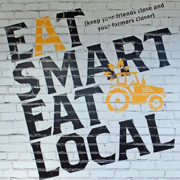 Wall graphic that says "Eat Smart Eat Local