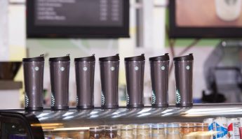 Reusable coffee mugs on table