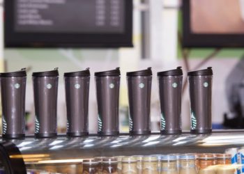 Reusable coffee mugs on table