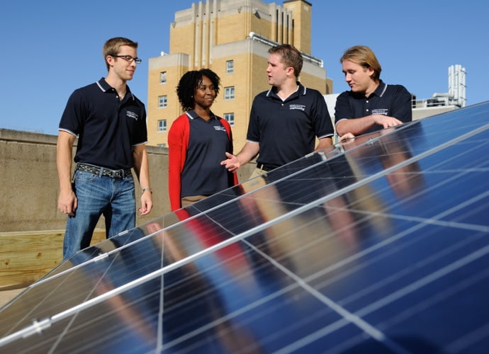 Students with rooftop solar photovoltaic panels on Benedum Hall roof, 2012
