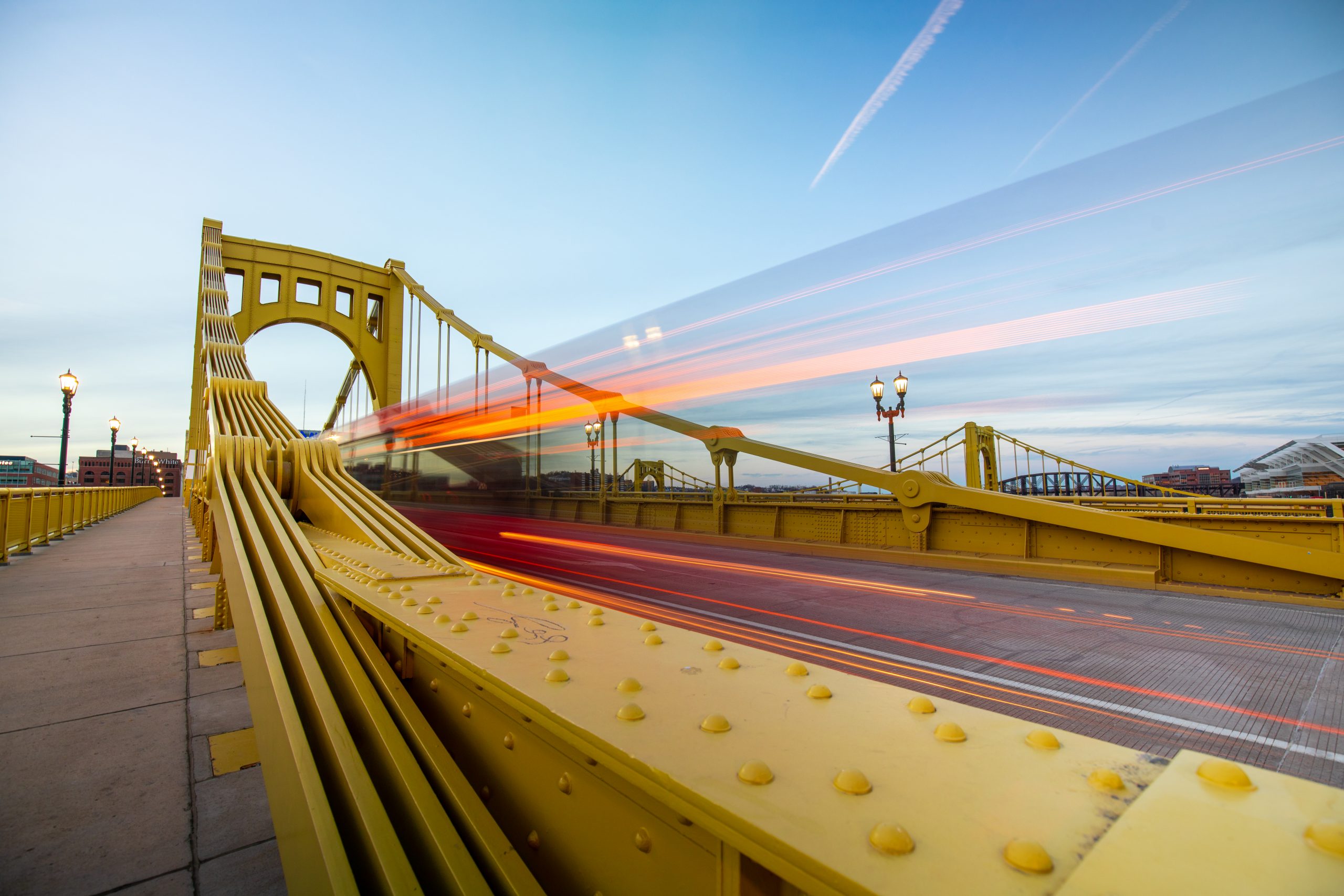 Yellow Pittsburgh bridge with fast movement