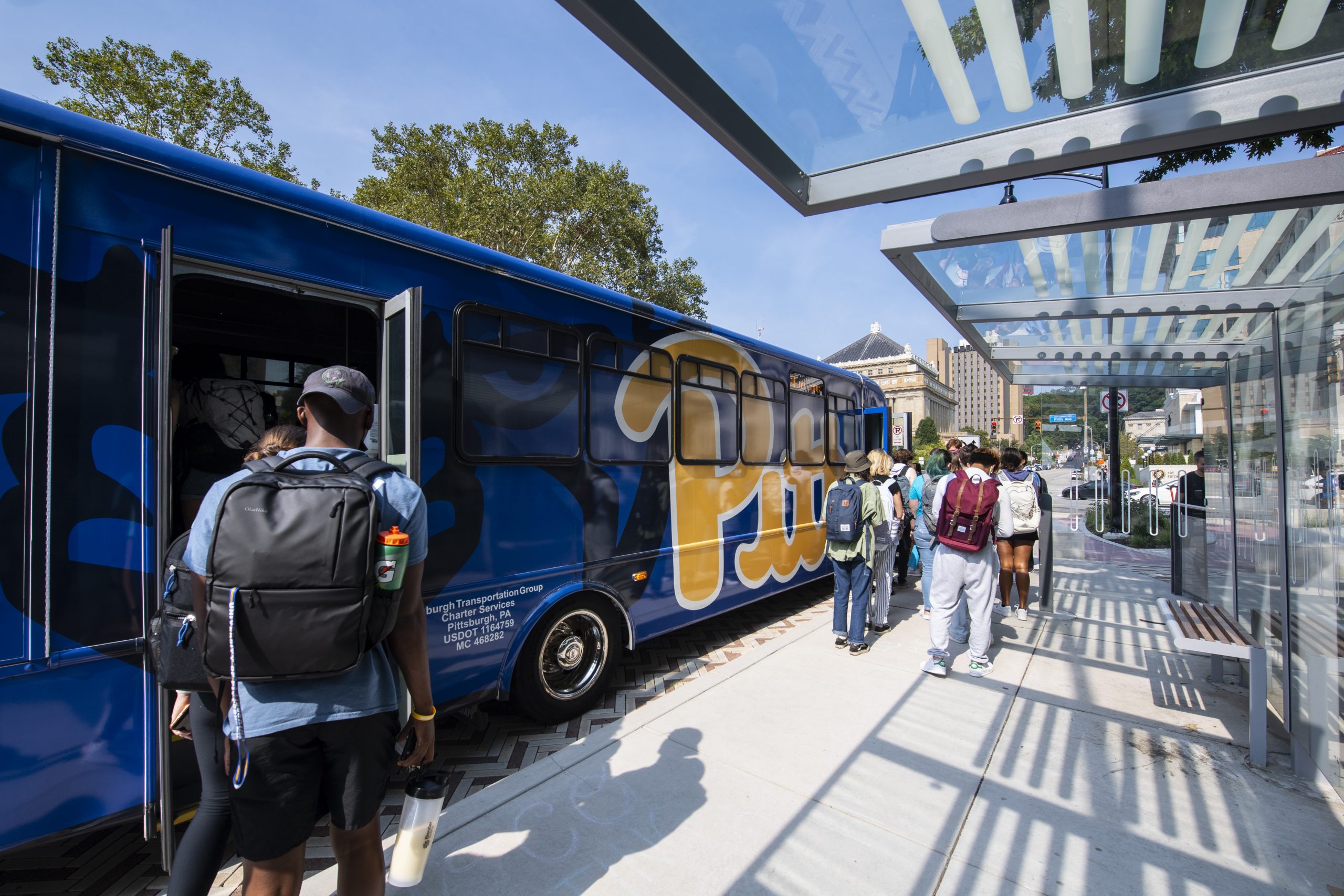 Students boarding Pitt bus.