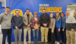 Ten members of the Pitt Athletics Administrative Office pose with their Green Office award.